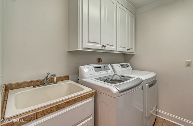 865 Wellington Way, Madison, MS 39110 - laundry area with washer and dryer, cabinet space, light tile patterned floors, crown molding, and baseboards