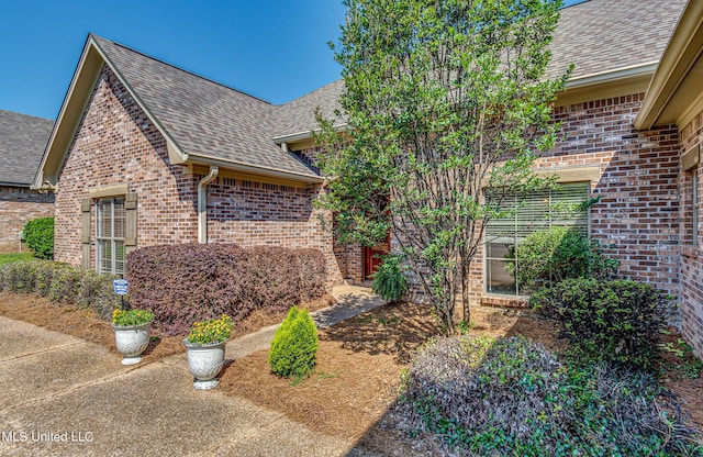 865 Wellington Way, Madison, MS 39110 - view of side of home with a shingled roof and brick siding