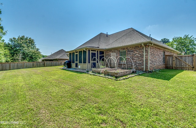 865 Wellington Way, Madison, MS 39110 - back of house with a sunroom, brick siding, and a shingled roof