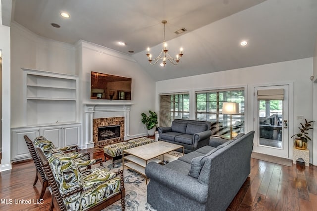 865 Wellington Way, Madison, MS 39110 - living area with a chandelier, plenty of natural light, dark wood-type flooring, built in shelves, and lofted ceiling