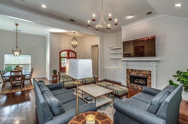 865 Wellington Way, Madison, MS 39110 - living room with ornamental molding, a chandelier, dark wood-style floors, a high end fireplace, and baseboards