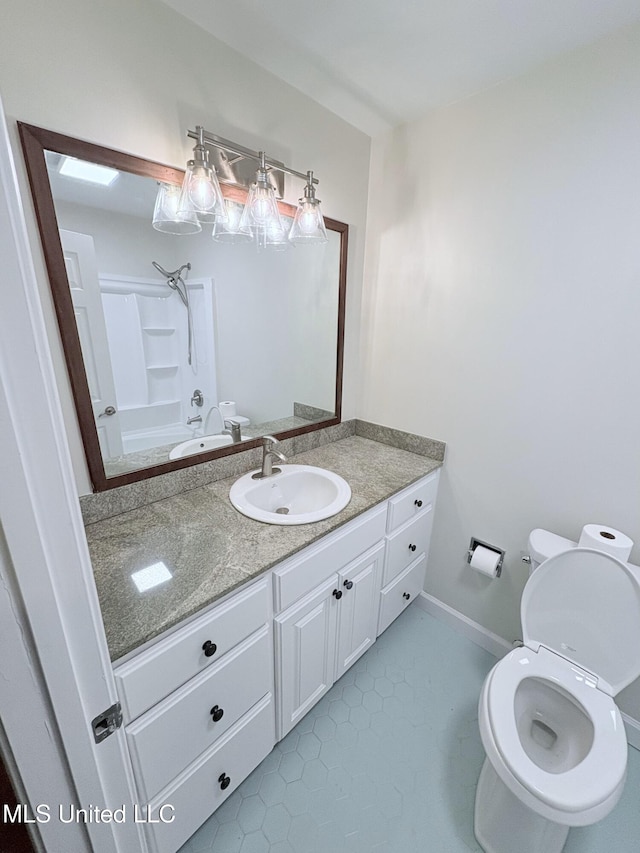 bathroom featuring toilet, tile patterned floors, bathing tub / shower combination, and vanity