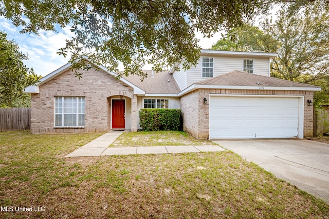 view of front property featuring a front yard and a garage