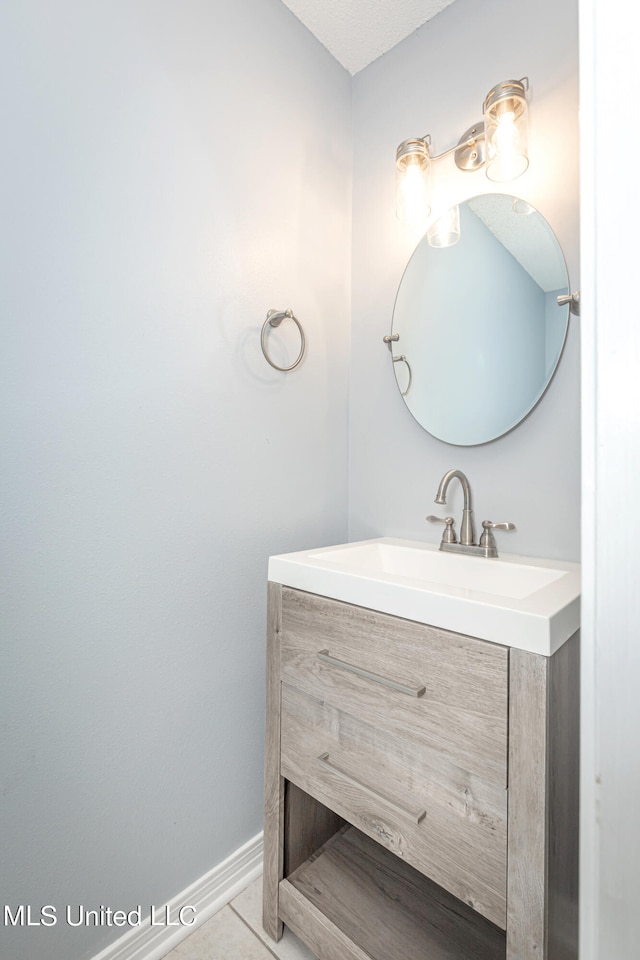 bathroom with vanity and tile patterned floors