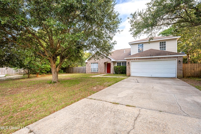 view of front facade featuring a front yard and a garage