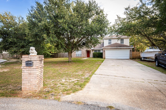 view of front of house with a front lawn and a garage