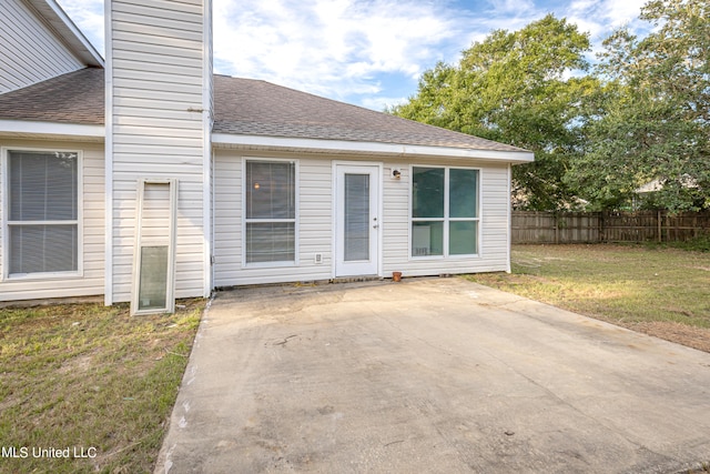 exterior space featuring a patio and a lawn