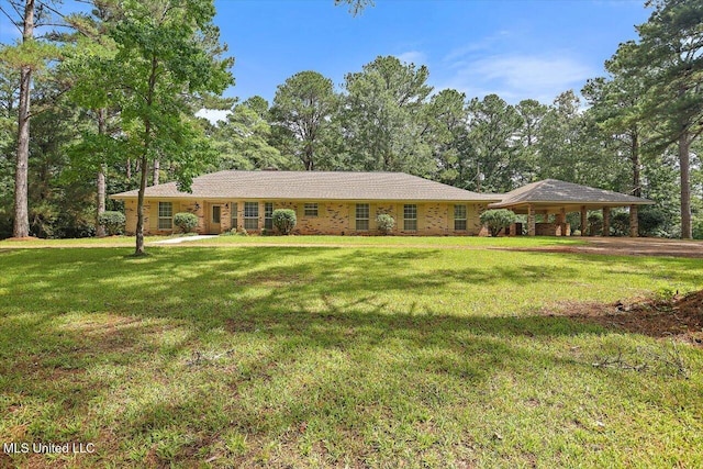 437 Henry Byrd Rd, Florence, MS 39073 - ranch-style house with a front yard, a carport, and view of scattered trees