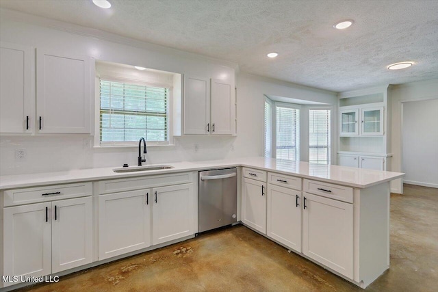 437 Henry Byrd Rd, Florence, MS 39073 - kitchen featuring stainless steel dishwasher, concrete flooring, a peninsula, white cabinetry, and a textured ceiling