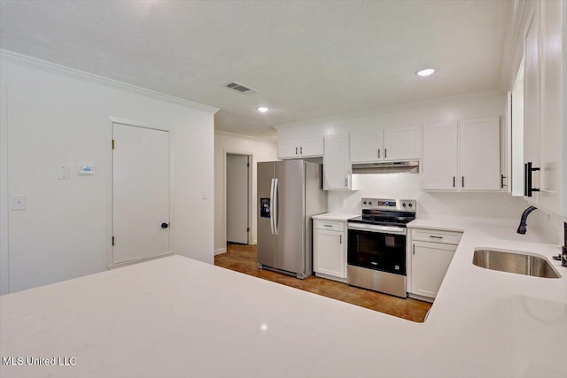 437 Henry Byrd Rd, Florence, MS 39073 - kitchen featuring stainless steel appliances, under cabinet range hood, ornamental molding, light countertops, and white cabinets