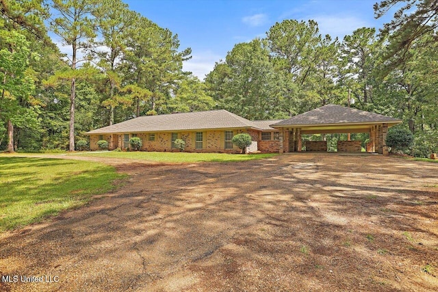437 Henry Byrd Rd, Florence, MS 39073 - single story home with driveway, a carport, a front yard, and brick siding