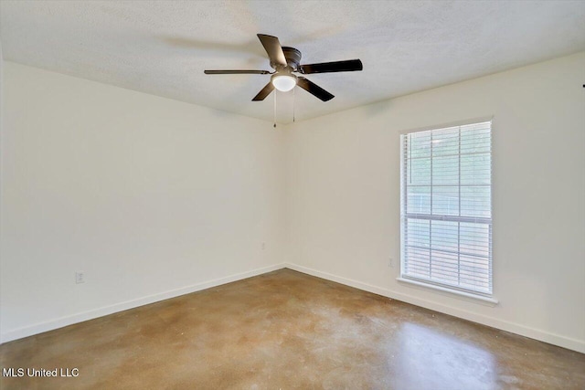 437 Henry Byrd Rd, Florence, MS 39073 - spare room with finished concrete flooring, a ceiling fan, and a textured ceiling