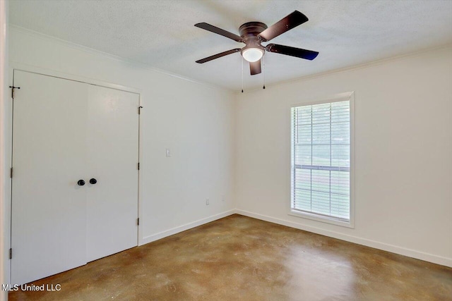 437 Henry Byrd Rd, Florence, MS 39073 - unfurnished bedroom featuring finished concrete flooring, crown molding, a ceiling fan, and a closet