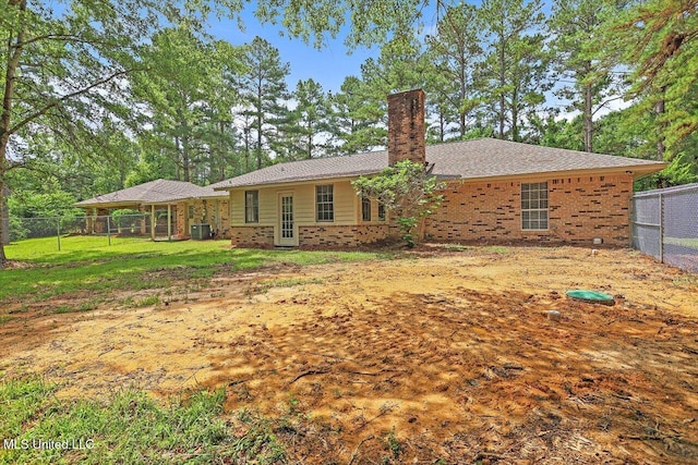 437 Henry Byrd Rd, Florence, MS 39073 - back of house featuring a chimney and brick siding