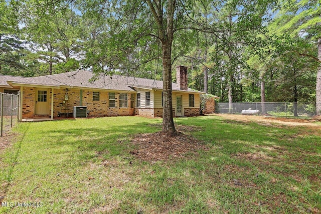 437 Henry Byrd Rd, Florence, MS 39073 - rear view of property with a chimney, a fenced backyard, and brick siding