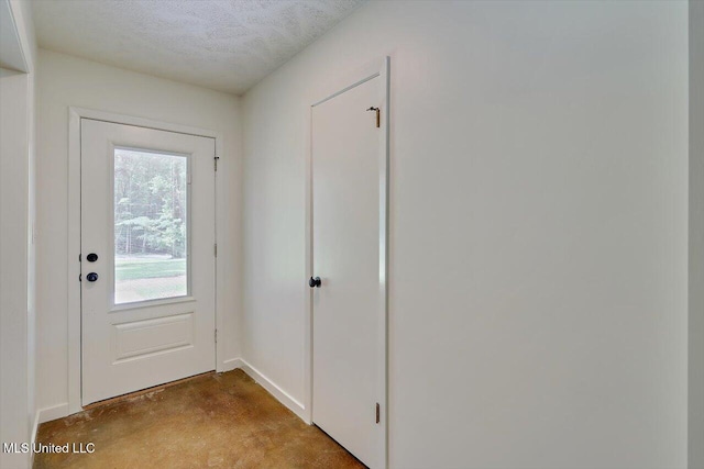 437 Henry Byrd Rd, Florence, MS 39073 - entryway with concrete flooring and a textured ceiling