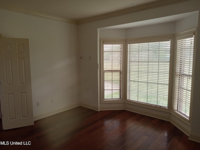 38 3rd St, Cleveland, MS 38732 - spare room featuring baseboards, dark wood-style floors, and ornamental molding