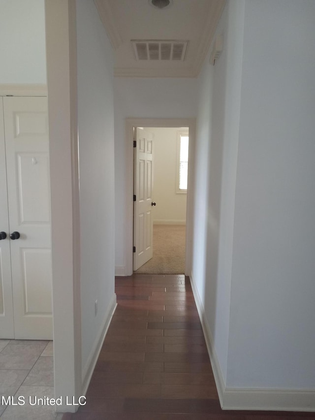38 3rd St, Cleveland, MS 38732 - hallway with baseboards, ornamental molding, wood finished floors, and visible vents