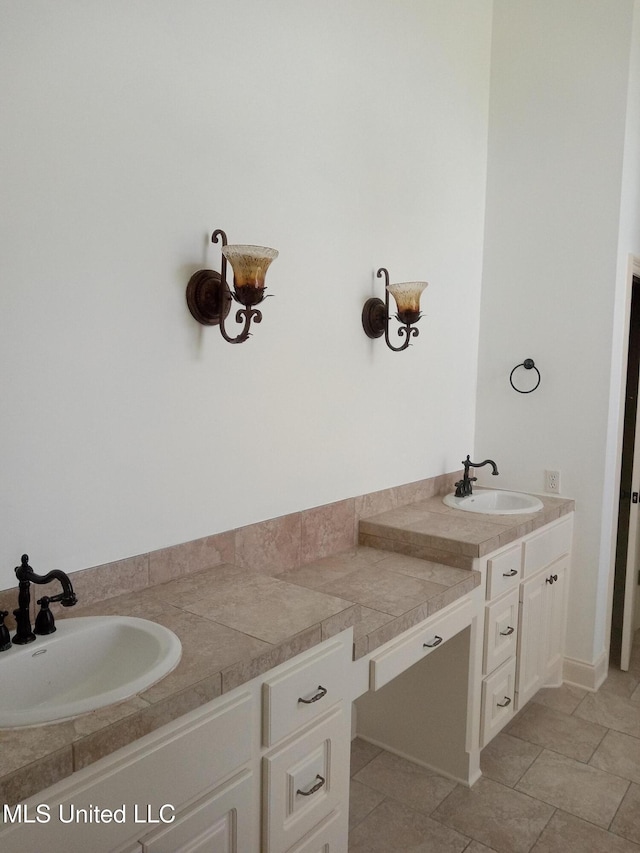 38 3rd St, Cleveland, MS 38732 - full bathroom featuring double vanity and a sink
