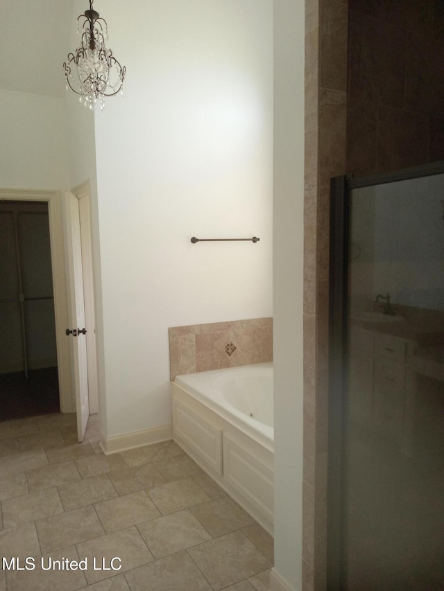 38 3rd St, Cleveland, MS 38732 - bathroom featuring an enclosed shower, a chandelier, and a garden tub