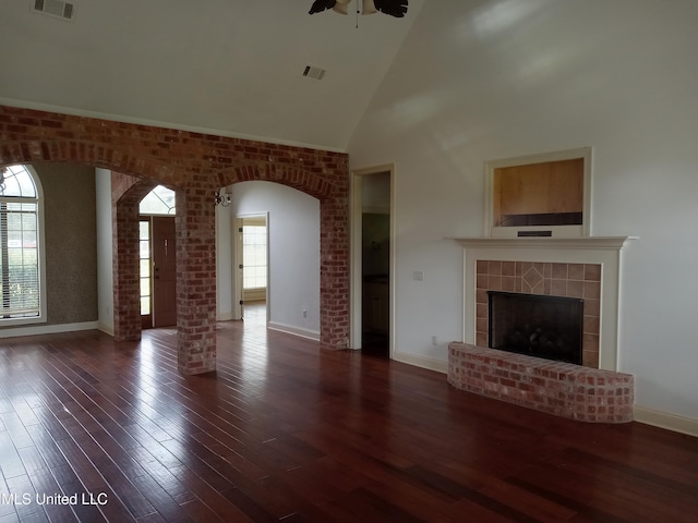 38 3rd St, Cleveland, MS 38732 - unfurnished living room featuring arched walkways, high vaulted ceiling, a ceiling fan, wood finished floors, and visible vents