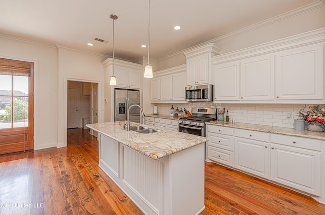 228 Falls Xing, Madison, MS 39110 - kitchen with appliances with stainless steel finishes, a sink, light wood-type flooring, backsplash, and recessed lighting