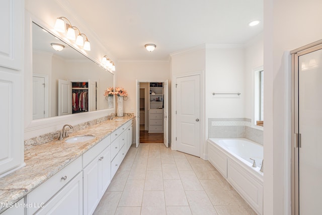 228 Falls Xing, Madison, MS 39110 - full bathroom featuring a walk in closet, a bath, vanity, ornamental molding, and a stall shower