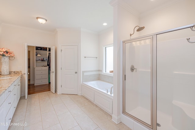 228 Falls Xing, Madison, MS 39110 - bathroom featuring a shower stall, a bath, vanity, crown molding, and a spacious closet
