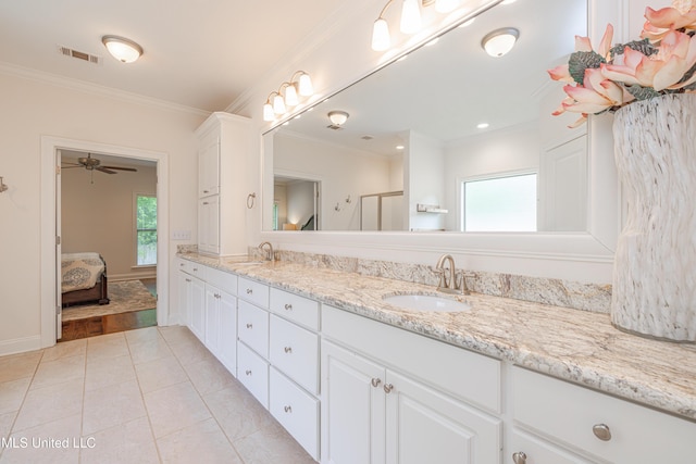 228 Falls Xing, Madison, MS 39110 - ensuite bathroom featuring double vanity, crown molding, tile patterned flooring, a ceiling fan, and baseboards