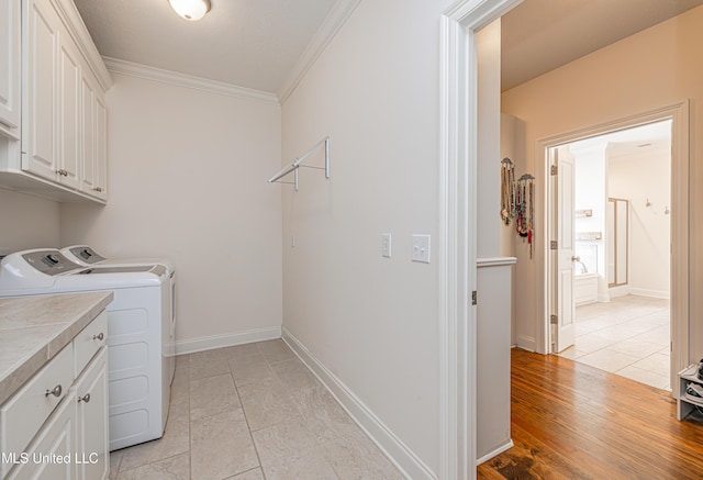 228 Falls Xing, Madison, MS 39110 - laundry room featuring cabinet space, ornamental molding, separate washer and dryer, and baseboards