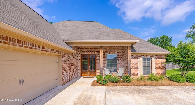 228 Falls Xing, Madison, MS 39110 - view of front of property featuring brick siding, a shingled roof, a garage, and concrete driveway