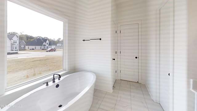 bathroom featuring a tub to relax in