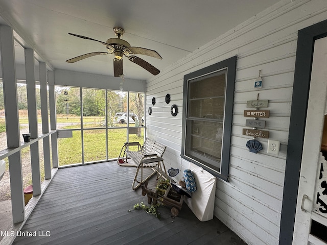 sunroom / solarium with ceiling fan