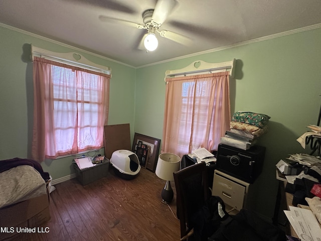 office space featuring ceiling fan, crown molding, and a healthy amount of sunlight