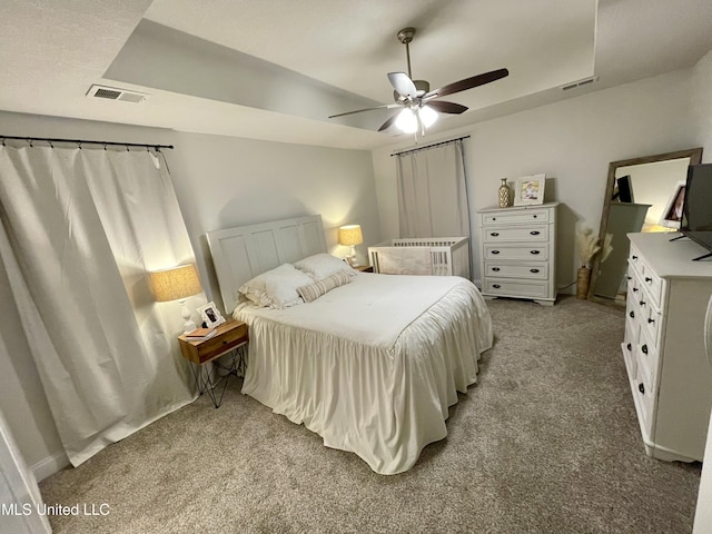 bedroom featuring ceiling fan and light carpet