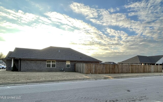 view of property exterior at dusk