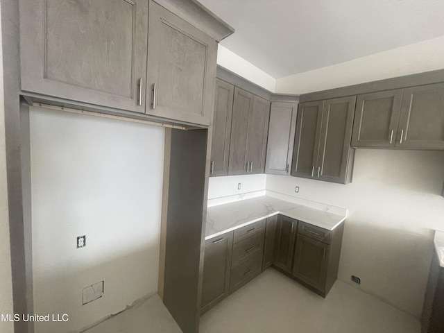 kitchen featuring light stone counters