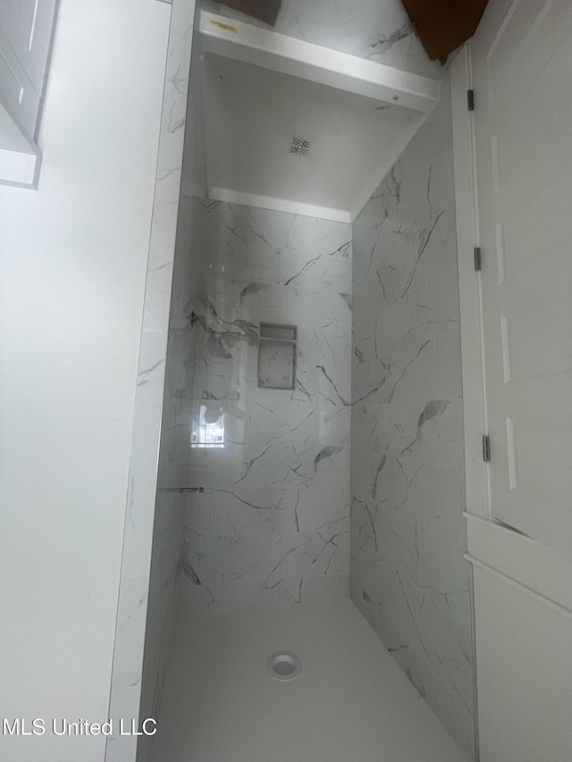 bathroom with a walk in shower