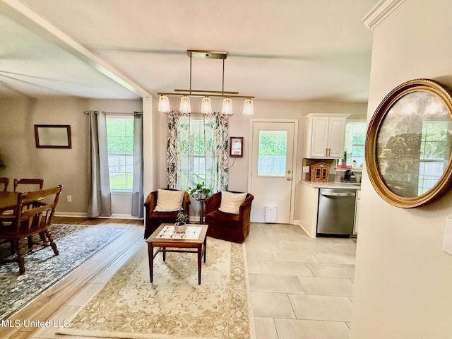 living room featuring baseboards and plenty of natural light