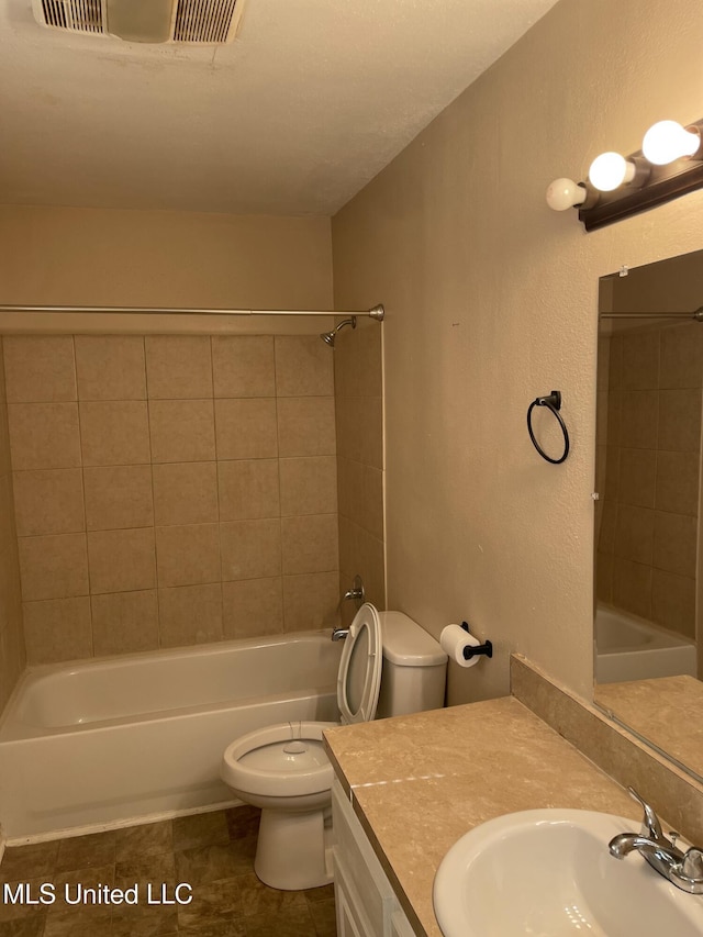 full bathroom with visible vents, toilet, shower / bathtub combination, tile patterned flooring, and vanity