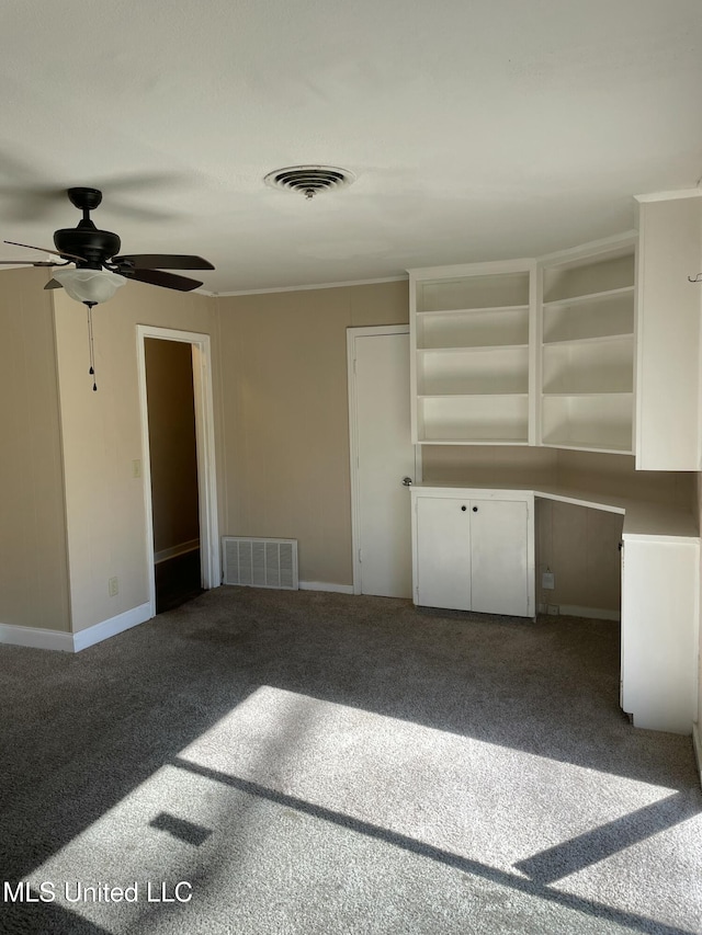 interior space with visible vents, carpet floors, and baseboards