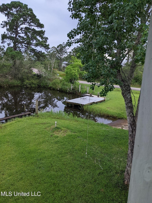 4021 Sailfish St, Bay Saint Louis, MS 39520 - view of grassy yard with a water view and a boat dock
