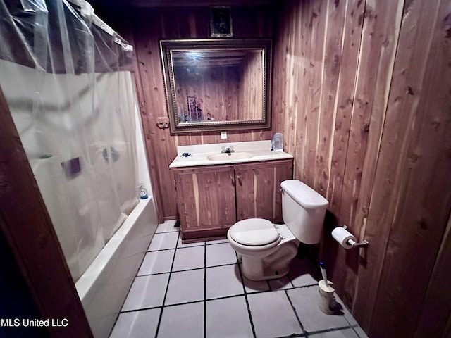 full bathroom featuring wood walls, toilet, tile patterned floors, vanity, and shower / bathtub combination with curtain