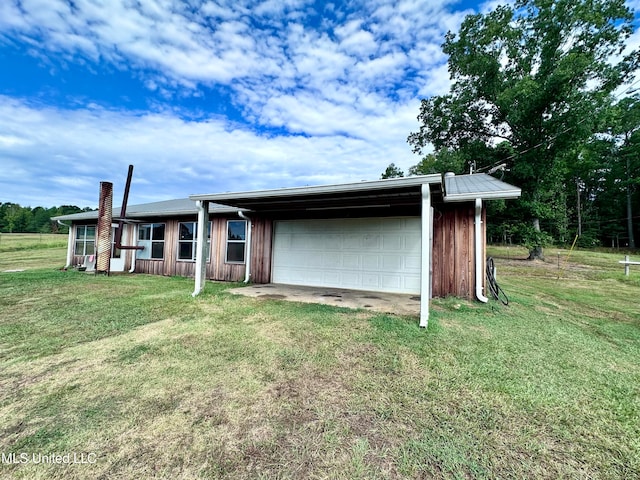 exterior space featuring a front yard and a garage