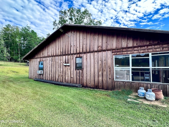 view of home's exterior with a yard