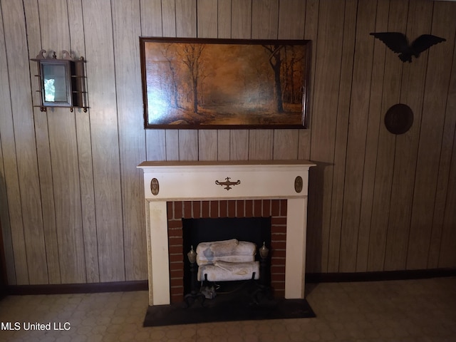 details with wood walls and a brick fireplace