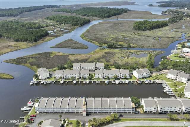 drone / aerial view with a water view and a residential view