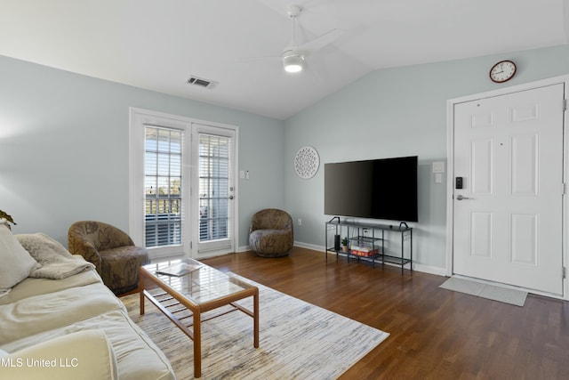 living room with lofted ceiling, visible vents, a ceiling fan, wood finished floors, and baseboards