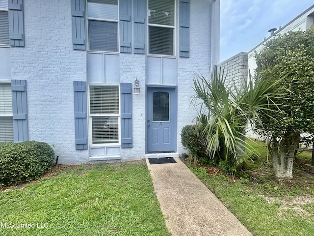 3230 Cumberland Rd Unit 71, Ocean Springs, MS 39564 - entrance to property featuring brick siding and a lawn