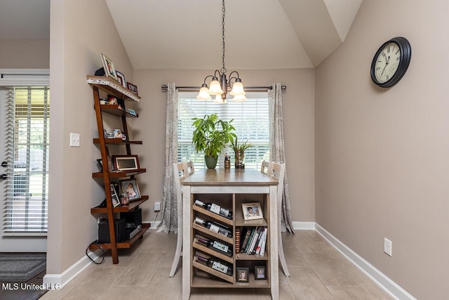 3289 Marion Ln, Southaven, MS 38672 - dining room with lofted ceiling, a chandelier, healthy amount of natural light, and light tile patterned floors